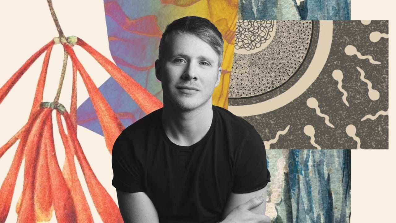 Man in black shirt with arms crossed against a vibrant abstract art collage background.
